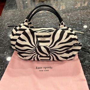 Kate spade shoulder bag unique bow is in print and looks like a 3d bow